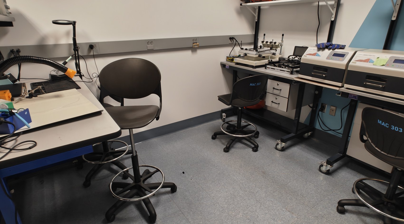 The finished Electronics Engineering Lab: clean benches with stools, instruments on shelves, labelled and sorted